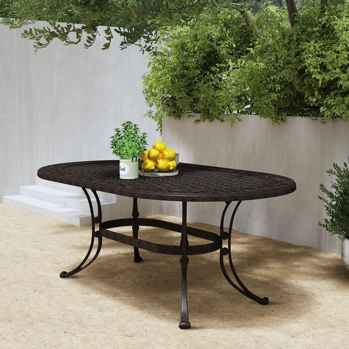 Set da pranzo per esterni Sanibel in alluminio color bronzo da 7 pezzi con tavolo da pranzo ovale da 72 pollici e sei poltrone di Homestyles